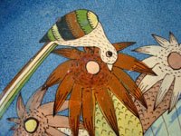 Closeup photo of Mexican pottery blue plate with bird