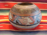 Mexican vintage pottery and ceramics, a fabulous globe-shaped pottery jar with an Aztec design, c. 1930's. Main photo.