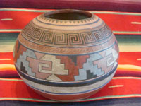 Mexican vintage pottery and ceramics, a fabulous globe-shaped pottery jar with an Aztec design, c. 1930's. Another side view of the globe-shaped jar.