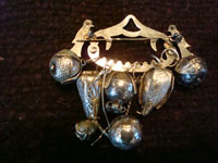 Vintage silver jewelry, a beautiful Andean (Peru or Ecuador) charm broach, c. 1930's. The broach has seven unique silver charms. Another closeup photo of the Andean charm broach.