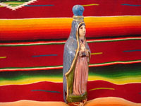 Mexican vintage pottery and ceramics, and Mexican vintage folk art, a holy water bottle depicting Our Lady of Guadalupe, Tlaquepaque, c. 1930-40. The bottle bears the early stamp of the Arias store in Tlaquepaque. Photo showing one side of bottle.
