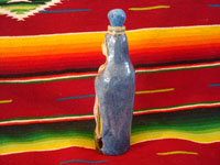 Mexican vintage pottery and ceramics, and Mexican vintage folk art, a holy water bottle depicting Our Lady of Guadalupe, Tlaquepaque, c. 1930-40. The bottle bears the early stamp of the Arias store in Tlaquepaque. Photo of the back of the bottle.