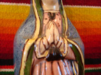 Mexican vintage pottery and ceramics, and Mexican vintage folk art, a holy water bottle depicting Our Lady of Guadalupe, Tlaquepaque, c. 1930-40. The bottle bears the early stamp of the Arias store in Tlaquepaque. Closeup of the Virgin's hands.