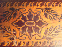 Mexican vintage wood-carving, a marquetry box with beautiful inlaid wood designs from Oaxaca, c. 1890. A closeup photo of the top of the marquetry box.
