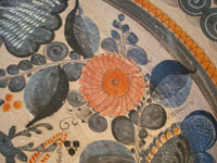 Mexican vintage pottery and ceramics, a beautiful burnished charger from Tonala, c. 1940. The burnished pottery charger features a lovely owl and two graceful deer amidst plants and foliage. Closeup of the flower on the front.