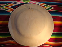 Mexican vintage pottery and ceramics, a beautiful burnished charger from Tonala, c. 1940. The burnished pottery charger features a lovely owl and two graceful deer amidst plants and foliage. Photo of the back of the charger.