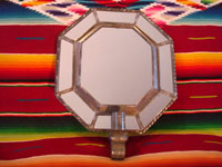 Mexican vintage tin-art (tinwork art), an octagonal tinwork mirror with a single candleholder at the base, c. 1930-40. Main photo.