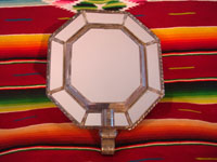 Mexican vintage tin-art (tinwork art), an octagonal tinwork mirror with a single candleholder at the base, c. 1930-40. Another view of the front side of the mirror.