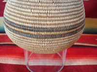 Native American Indian basket, a very finely woven polychrome olla, Chemehuevi, c. 1920's. Closeup photo of the polychrome band around the middle of the Chemehuevi Indian basket.