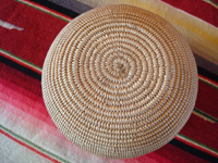 Native American Indian basket, a very finely woven polychrome olla, Chemehuevi, c. 1920's. A photo of the bottom of the Chemehuevi Indian basket.