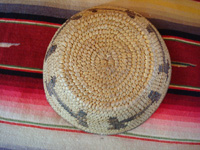 Native American Indian basket, a lovely pictorial basket with figures of dogs around the sides, Tohono 'odam (formerly known as Papago), c. 1920-30's. Photo showing the bottom of the Papago pictorial Indian basket.