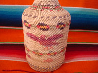 Native American Indian vintage basketry and weaving, a wonderful basketry covered bottle, Makah, Washington state, c. 1940.  Closeup photo of the bottle showing the eagle.