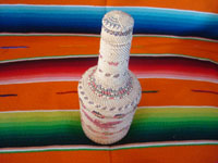 Native American Indian vintage basketry and weaving, a wonderful basketry covered bottle, Makah, Washington state, c. 1940.  Photo shot from above the bottle looking down at the top.