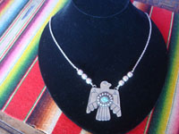 Native American Indian vintage sterling silver jewelry, a wonderful Fred Harvey sterling silver pendant in the form of an eagle, silver and turquoise on a silver chain with six silver spheres, Arizona or New Mexico, c. 1940's. Main photo of the pendant.