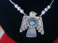 Native American Indian vintage sterling silver jewelry, a wonderful Fred Harvey sterling silver pendant in the form of an eagle, silver and turquoise on a silver chain with six silver spheres, Arizona or New Mexico, c. 1940's. Closeup photo of the eagle pendant.