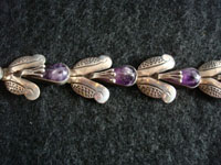 Closeup photo of Mexican vintage silver bracelet with amethyst.