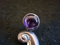 Closeup photo of vintage Mexican sterling silver earrings with amethyst.