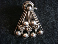 Closeup photo of Mexican vintage silve jewelry, Taxco sterling silver earrings with fan-shape.