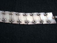Photo of back side of Mexican vintage silver jewelry, Taxco sterling silver bracelet inlaid with abalone shell.