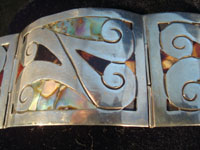 Mexican vintage silver jewelry and Taxco vintage silver jewelry, a sterling silver bracelet with abalone and tortoise shell inlay, c. 1940's.  A closeup photo of the bracelet.