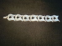 Mexican vintage silver jewelry and Taxco vintage silver jewelry, a sterling silve bracelet, c. 1940's. The work on this piece is exquisite!  Photo of bracelet fully extended.