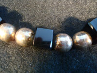 Mexican vintage silver jewelry and Taxco silver jewelry, a wonderful necklace composed of silver balls and square pieces of black jet, signed with the mark and number of Jose Marmolejo, Taxco, c. 1960-70's. A closeup photo, showing the beads and squares of black jet.