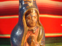 Mexican vintage pottery and ceramics and Mexican vintage folk art, a pottery bottle in the form of Our Lady of Guadalupe from Tlaquepaque, Jalisco, c. 1930's. Photo of the face of the Virgen.