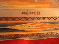 Mexican vintage "straw-art" (popote art or popotillo) tray, c. 1940's. The popote art is very fine and very intricate. The frame is also decorated with very fine popote or straw-art, and incised geomtric patterns in the wood on the handles of the frame and and in the wood immediately around the central image. Another closeup photo of the frame.