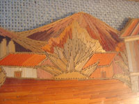 Mexican vintage "straw-art" (popote art or popotillo) tray, c. 1940's. The popote art is very fine and very intricate. The frame is also decorated with very fine popote or straw-art, and incised geomtric patterns in the wood on the handles of the frame and and in the wood immediately around the central image. Another closeup photo showing a volcano in the background.