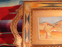 Mexican vintage "straw-art" (popote art or popotillo) tray, c. 1940's. The popote art is very fine and very intricate. The frame is also decorated with very fine popote or straw-art, and incised geomtric patterns in the wood on the handles of the frame and and in the wood immediately around the central image. A closeup photo showing one handle of the frame with the incised pattern.