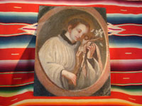 Mexican vintage devotional art, a retablo painted on tin, c. 1890-1900. The retablo is very beautifully painted with an image of St. Stanislaus Koska, a Jesuit saint much revered in Mexico. Photo showing the entire retablo.