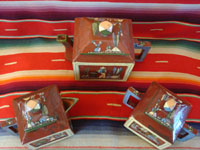 Mexican vintage pottery and ceramics, an entire tea set with teapot, creamer and sugar-bowl, and six cups, from the pottery center of Tlaquepaque, Jalisco, c. 1930's. A photo shot from above the three main vessels of the tea set.