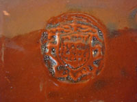 Mexican vintage pottery and ceramics, an entire tea set with teapot, creamer and sugar-bowl, and six cups, from the pottery center of Tlaquepaque, Jalisco, c. 1930's. A photo showing the Arias stamp on the bottom of one of the pieces.