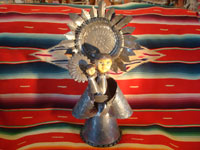 Mexican vintage tin-art (tinwork-art) and Mexican vintage devotional and folk art, a tin-art Virgin with Child, c. 1960. The stamping on the tinwork is wonderful, and the faces of the Virgin and Child are ceramic and are beautifully painted. Main photo.