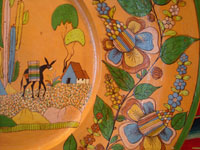 Mexican vintage pottery and ceramics, an incredibly large and beautiful pottery charger from Tlaquepaque, Jalisco, c. 1920-30's. The artwork on this charger is spectacular. This piece is museum-quality! A closeup photo.