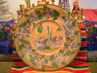 Mexican vintage pottery and ceramics, an incredibly large and beautiful pottery charger from Tlaquepaque, Jalisco, c. 1920-30's. The artwork on this charger is spectacular. This piece is museum-quality! Main photo of charger.