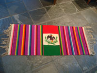 Mexican vintage textiles and sarapes, a textile or sarape woven of fine wool and representing the Mexican flag and national symbol of the eagle with snake, c. 1940. The piece bears the traditional colors of the Mexican flag: red, green, and white. Main photo of the sarape.