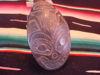 Native American Indian arts and antiques and Northwest Coast Indian arts, a beautiful spoon, made from horn, and incised with an image of a whale, Northwest Coast, Haida people of the Queen Charlotte Islands, British Columbia, c. 1860-80. Closeup of the incised whale on the spoon.