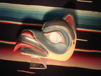 Native American Indian wood-carving and folk art, a Northwest Coast carved wooden miniature mask in the form of a bear with abalone inlaid eyes, signed LAVALLE, c. 1960's. Photo showing a side of the mask.