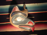 Native American Indian wood-carving and folk art, a Northwest Coast carved wooden miniature mask in the form of a bear with abalone inlaid eyes, signed LAVALLE, c. 1960's. Photo showing the second side of the miniature mask.