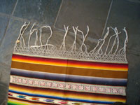 Mexican vintage textiles and sarapes, a spectacular Saltillo sarape with bands of tela deshilada (threads are removed and lovely flowers are then created with the remaining threads), c. 1920-40. This is an extremely rare and beautiful Mexican textile.  Photo of one end of the sarape showing the beautiful fringe.