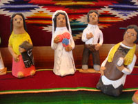 UU-3: Mexican vintage folk-art, and Mexican vintage pottery and ceramics, a wonderful and whimsical wedding scene filled with beautifully crafted pottery figures, by the very famous folk-artist, Josephina Aguilar of Acatlan, Oaxaca, c. 1960's. Photo of the priest with the bride and groom.