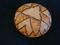 Native American Indian baskets, a stunning Mission basket, Cahuilla, Palm Springs area, c. 1920. Photo of the bottom side of the Cahilla Mission Indian basket.