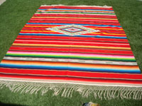 Mexican vintage textiles and Saltillo serapes (sarapes), a wonderful Saltillo serape with a red background and a beautiful center medallion, Saltillo, Coahuilla, c. 1940. Main photo of the serape.