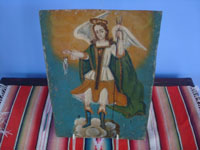 Mexican vintage devotional art. a retablo painted on tin depicting San Rafael the Archangel, Mexico, c. 1900. Main photo of the retablo.