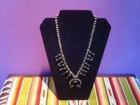 Native Amaerican vintage sterling silver jewelry, and Navajo vintage sterling silver jewelry, a beautiful squash blossom necklace, all silver with stamping on blossoms and Naja, Arizona or New Mexico, c. 1950's. Main image of the necklace.