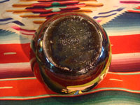 Mexican vintage pottery and ceramics, and Mexican vintage folk art, a pottery bowl or tecomate with wonderful rural scenes on blackware, from Tlaquepaque, Jalisco, c. 1930. A photo showing the bottom of the bowl.