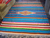 Mexican vintage textiles and sarapes, a beautiful Saltillo sarape with a turquoise background and wonderful center medallion, c. 1940.