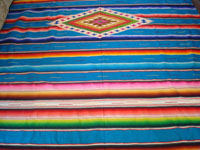 Mexican vintage textiles and sarapes, a beautiful Saltillo sarape with a turquoise background and wonderful center medallion, c. 1940. Another closeup view.