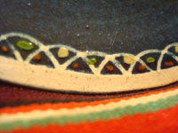 Mexican vintage pottery and ceramics, and Mexican vintage folk art, a pottery plate from Tlaquepaque, Jalisco, with a wonderful scene of a fox and beautiful bird (a quetzal), on a dark blue slip, c. 1930-40. A closeup photo of one edge of the plate showing the intricate border.